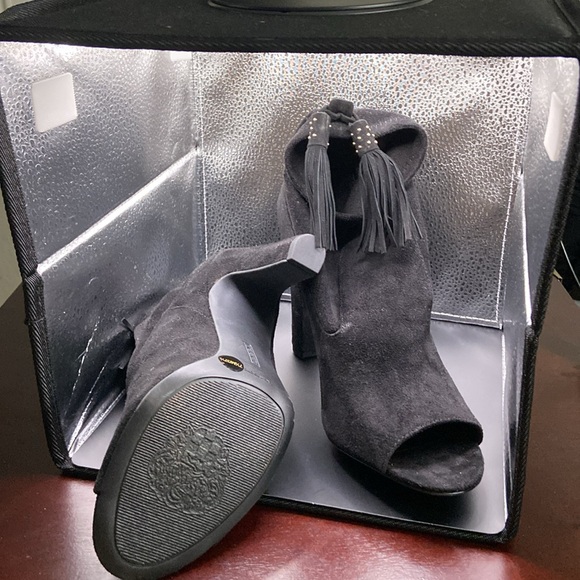 Black suede ankle heel boots with black and white tassel on back and open toe. - Picture 2 of 3